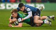 18 December 2022; Fin Smith of Northampton Saints is tackled by Calvin Nash of Munster during the Heineken Champions Cup Pool B Round 2 match between Northampton Saints and Munster at Franklin's Gardens in Northampton, England. Photo by Seb Daly/Sportsfile