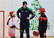 19 December 2022; Limerick hurler Declan Hannon with Grace Gavin from Castletroy in Limerick, left, and Abbi Townsend, from Durrow in Laois, at the inaugural GAA Vision Sports Hurling Event, which was held at at Gaelscoil Chaladh an Treoigh in Newcastle, Limerick, where Limerick hurling stars Declan Hannon and Aaron Costello were in attendance. Photo by Piaras Ó Mídheach/Sportsfile