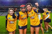17 December 2022; Clonduff players, from left, Ceallagh Byrne, Erin Rafferty and Beth Fitzpatrick celebrate after their side's victory in the AIB All-Ireland Intermediate Camogie Club Championship Final match between Clonduff of Down and James Stephens of Kilkenny at Croke Park in Dublin. Photo by Piaras Ó Mídheach/Sportsfile