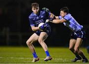 21 December 2022; Brian O'Leary of Dublin West, left, in action against Paudie White of Dublin Development Squad during the Dave Hickey Plate Final match between Dublin West and Dublin Development Squad at the Dublin City University Sports Campus in Dublin. Photo by Seb Daly/Sportsfile