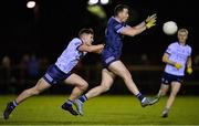 21 December 2022; Cormac Costello of Dublin North in action against Peader O’Cofaigh Byrne of Dublin South during the Dave Hickey Cup Final match between Dublin North and Dublin South at the Dublin City University Sports Campus in Dublin. Photo by Seb Daly/Sportsfile