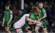 23 December 2022; Cian Prendergast of Connacht is tackled by Nick Timoney of Ulster during the United Rugby Championship match between Connacht and Ulster at The Sportsground in Galway. Photo by Piaras Ó Mídheach/Sportsfile