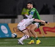 23 December 2022; Tiernan O'Halloran of Connacht is tackled by Mike Lowry of Ulster during the United Rugby Championship match between Connacht and Ulster at The Sportsground in Galway. Photo by Piaras Ó Mídheach/Sportsfile
