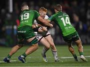 23 December 2022; Nathan Doak of Ulster is tackled by Shamus Hurley-Langton, left, and John Porch of Connacht during the United Rugby Championship match between Connacht and Ulster at The Sportsground in Galway. Photo by Piaras Ó Mídheach/Sportsfile