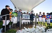 26 December 2022; Recently retired jockey Davy Russell, right, is presented with a montage by Leopardstown Racecourse chief executive Tim Husbands and fellow jockeys during day one of the Leopardstown Christmas Festival at Leopardstown Racecourse in Dublin. Photo by Seb Daly/Sportsfile