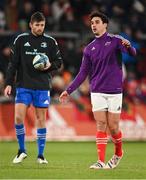 26 December 2022; Joey Carbery of Munster, right, and Ross Byrne of Leinster during the warm-up before the United Rugby Championship match between Munster and Leinster at Thomond Park in Limerick. Photo by Piaras Ó Mídheach/Sportsfile