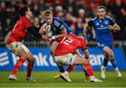 26 December 2022; Jamie Osborne of Leinster is tackled by Joey Carbery, left, and Jack Crowley of Munster during the United Rugby Championship match between Munster and Leinster at Thomond Park in Limerick. Photo by Piaras Ó Mídheach/Sportsfile
