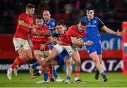 26 December 2022; Shane Daly of Munster is tackled by James Lowe of Leinster during the United Rugby Championship match between Munster and Leinster at Thomond Park in Limerick. Photo by Piaras Ó Mídheach/Sportsfile