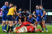 26 December 2022; Leinster players celebrate with teammate Dan Sheehan, hidden, after he scored their side's second try during the United Rugby Championship match between Munster and Leinster at Thomond Park in Limerick. Photo by Eóin Noonan/Sportsfile