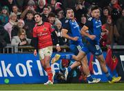 26 December 2022; Joey Carbery of Munster looks on after missing a second half conversion attempt, as Leinster players James Lowe and Hugo Keenan, right, run past during the United Rugby Championship match between Munster and Leinster at Thomond Park in Limerick. Photo by Piaras Ó Mídheach/Sportsfile