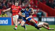 26 December 2022; Luke McGrath of Leinster in action against Calvin Nash of Munster during the United Rugby Championship match between Munster and Leinster at Thomond Park in Limerick. Photo by Eóin Noonan/Sportsfile