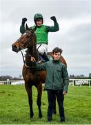 27 December 2022; Jockey Daryl Jacob and groom Sean Cleary celebrate after winning the Paddy's Rewards Club Steeplechase with Blue Lord on day two of the Leopardstown Christmas Festival at Leopardstown Racecourse in Dublin. Photo by Seb Daly/Sportsfile