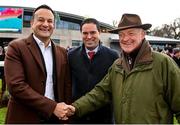 27 December 2022; An Taoiseach Leo Varadkar, left, shakes hands with trainer Willie Mullins, who sent out Facile Vega to win the Paddy Power Future Champions Novice Hurdle, on day two of the Leopardstown Christmas Festival at Leopardstown Racecourse in Dublin. Photo by Seb Daly/Sportsfile