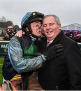 27 December 2022; Jockey Conor McNamara and father trainer Eric McNarmara celebrate after winning the Paddy Power Extended Handicap Steeplechase with Real Steal on day two of the Leopardstown Christmas Festival at Leopardstown Racecourse in Dublin. Photo by Seb Daly/Sportsfile