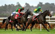 28 December 2022; Sam's Choice, left, with Jack Kennedy up, on their way to winning the Irish Daily Star Christmas Handicap Hurdle, from second place Gali Flight, right, with Niall Moore up, on day three of the Leopardstown Christmas Festival at Leopardstown Racecourse in Dublin. Photo by Seb Daly/Sportsfile