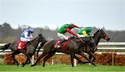 28 December 2022; Sam's Choice, centre, with Jack Kennedy up, on their way to winning the Irish Daily Star Christmas Handicap Hurdle, from second place Gali Flight, right, with Niall Moore up, on day three of the Leopardstown Christmas Festival at Leopardstown Racecourse in Dublin. Photo by Seb Daly/Sportsfile