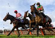 28 December 2022; Jiving Jerry, left, with Sarah Kavanagh up, Takarengo, centre, with Danny Mullins up, and Hemlock, right, with Darragh O'Keeffe up, jump the last during the first circuit of the Pertemps Network Handicap Hurdle on day three of the Leopardstown Christmas Festival at Leopardstown Racecourse in Dublin. Photo by Seb Daly/Sportsfile
