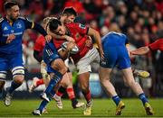 26 December 2022; Antoine Frisch of Munster is tackled by Ross Byrne of Leinster during the United Rugby Championship match between Munster and Leinster at Thomond Park in Limerick. Photo by Piaras Ó Mídheach/Sportsfile