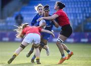 30 December 2022; Eimear Corri of Leinster is tackled by Sadhbh McGrath, left, and Brenda Barr of Ulster during the Women's Interprovincial Friendly match between Leinster and Ulster at Energia Park in Dublin. Photo by David Fitzgerald/Sportsfile
