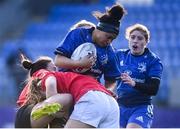 30 December 2022; Eimear Corri of Leinster is tackled by Sadhbh McGrath, right, and Brenda Barr of Ulster during the Women's Interprovincial Friendly match between Leinster and Ulster at Energia Park in Dublin. Photo by David Fitzgerald/Sportsfile