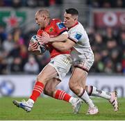 1 January 2023; Keith Earls of Munster is tackled by James Hume of Ulster during the United Rugby Championship between Ulster and Munster at Kingspan Stadium in Belfast. Photo by Ramsey Cardy/Sportsfile