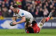 1 January 2023; James Hume of Ulster is tackled by Malakai Fekitoa of Munster during the United Rugby Championship between Ulster and Munster at Kingspan Stadium in Belfast. Photo by Ramsey Cardy/Sportsfile