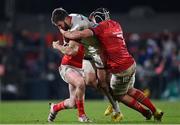 1 January 2023; Stuart McCloskey of Ulster is tackled by Ben Healy, left, and Alex Kendellen of Munster during the United Rugby Championship between Ulster and Munster at Kingspan Stadium in Belfast. Photo by Ramsey Cardy/Sportsfile