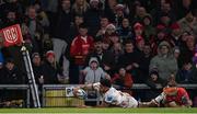1 January 2023; Robert Baloucoune of Ulster dives over to score his side's first try despite the tackle of Mike Haley of Munster during the United Rugby Championship between Ulster and Munster at Kingspan Stadium in Belfast. Photo by Ramsey Cardy/Sportsfile