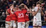 1 January 2023; Munster players celebrate at the final whistle of the United Rugby Championship between Ulster and Munster at Kingspan Stadium in Belfast. Photo by Ramsey Cardy/Sportsfile