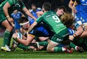 1 January 2023; Brian Deeny of Leinster dives over to score his side's second try despite the tackle of Caolin Blade and Cian Prendergast of Connacht during the United Rugby Championship between Leinster and Connacht at RDS Arena in Dublin. Photo by Harry Murphy/Sportsfile