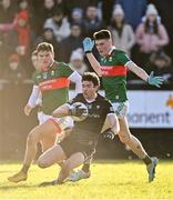2 January 2023; Luke Towey of Sligo in action against Jordan Flynn, left, and Cormac Howley of Mayo during the challenge match between Mayo and Sligo at James Stephen's Park in Ballina, Mayo. Photo by Piaras Ó Mídheach/Sportsfile