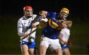 3 January 2023; Carthach Daly of Waterford in action against Pauric Campion of Tipperary during the Co-Op Superstores Munster Hurling League Group 1 match between Waterford and Tipperary at Mallow GAA Sports Complex in Cork. Photo by Eóin Noonan/Sportsfile