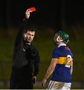 3 January 2023; Referee John O'Halloran shows a red card to Cathal Barrett of Tipperary to during the Co-Op Superstores Munster Hurling League Group 1 match between Waterford and Tipperary at Mallow GAA Sports Complex in Cork. Photo by Eóin Noonan/Sportsfile