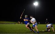 3 January 2023; Paddy Cadell of Tipperary in action against Colin Dunford of Waterford during the Co-Op Superstores Munster Hurling League Group 1 match between Waterford and Tipperary Mallow GAA Sports Complex in Cork. Photo by Eóin Noonan/Sportsfile