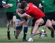 4 January 2023; Daniel Norval of South East is tackled by Alex Carter of North Eastduring the Shane Horgan Cup Round Three match between South East and North East at Clontarf RFC in Dublin. Photo by Harry Murphy/Sportsfile