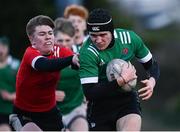 4 January 2023; Matthew McGowan of South East is tackled by Ronan Foley of North East during the Shane Horgan Cup Round Three match between South East and North East at Clontarf RFC in Dublin. Photo by Harry Murphy/Sportsfile