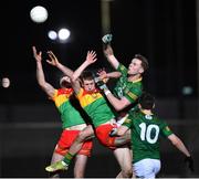 4 January 2023; Conor Moriarty of Meath looks on as his team-mate Brian Conlon challenges Carlow players Liam Brennan and Finbar Kavanagh during the O'Byrne Cup Group B Round 1 match between Carlow and Meath at Netwatch Cullen Park in Carlow. Photo by Ray McManus/Sportsfile