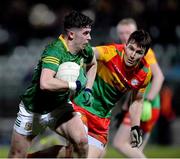 4 January 2023; Jason Scully of Meath in action against Ciaran Moran of Carlow during the O'Byrne Cup Group B Round 1 match between Carlow and Meath at Netwatch Cullen Park in Carlow. Photo by Ray McManus/Sportsfile
