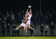 4 January 2023; Aaron Masterson of Kildare in action against Darragh Lyons of Wexford during the O'Byrne Cup Group A Round 1 match between Wexford and Kildare at St Patrick's Park in Enniscorthy, Wexford. Photo by Piaras Ó Mídheach/Sportsfile