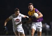 4 January 2023; Glen Malone of Wexford in action against Jack Sargent of Kildare during the O'Byrne Cup Group A Round 1 match between Wexford and Kildare at St Patrick's Park in Enniscorthy, Wexford. Photo by Piaras Ó Mídheach/Sportsfile