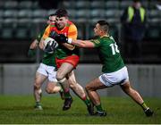 4 January 2023; Paidrig Hynes of Carlow in action against Robin Clarke of Meath during the O'Byrne Cup Group B Round 1 match between Carlow and Meath at Netwatch Cullen Park in Carlow. Photo by Ray McManus/Sportsfile