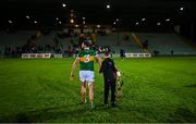 5 January 2023; Bobby Boyle helps his father, Kerry hurler Mikey Boyle, carry his hurleys and helmet as they leave the pitch after the Co-Op Superstores Munster Hurling League Group 2 match between Kerry and Cork at Austin Stack Park in Tralee, Kerry. Photo by Brendan Moran/Sportsfile