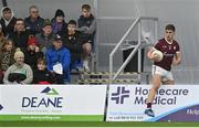 6 January 2023; Billy Mannion of Galway retrieves the ball from behind the advertisement boards during the Connacht FBD League Round 1 match between Leitrim and Galway at the NUI Galway Connacht GAA Air Dome in Bekan, Mayo. Photo by David Fitzgerald/Sportsfile