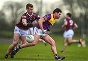 7 January 2023; Liam O'Connor of Wexford is tackled by John Heslin of Westmeath during the O'Byrne Cup Group A Round 2 match between Westmeath and Wexford at The Downs GAA club in Mullingar, Westmeath. Photo by Sam Barnes/Sportsfile