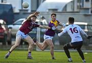 7 January 2023; Robbie Brooks of Wexford in action against David Giles, left, and Westmeath goalkeeper Trevor Martin during the O'Byrne Cup Group A Round 2 match between Westmeath and Wexford at The Downs GAA club in Mullingar, Westmeath. Photo by Sam Barnes/Sportsfile