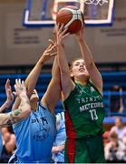 7 January 2023; Claire Melia of Trinity Meteors catches a rebound ahead of Hannah Thornton of DCU Mercy during the Basketball Ireland Paudie O'Connor Cup Semi-Final match between DCU Mercy and Trinity Meteors at Neptune Stadium in Cork. Photo by Brendan Moran/Sportsfile