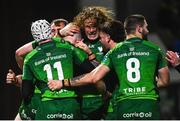 7 January 2023; Cathal Forde of Connacht, hidden, celebrates with teammates after scoring his side's second try during the United Rugby Championship match between Connacht and Cell C Sharks at the Sportsground in Galway. Photo by Eóin Noonan/Sportsfile