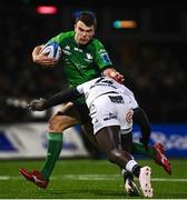 7 January 2023; Tom Farrell of Connacht is tackled by Yaw Penze of Cell C Sharks during the United Rugby Championship match between Connacht and Cell C Sharks at the Sportsground in Galway. Photo by Eóin Noonan/Sportsfile