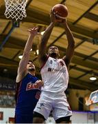 7 January 2023; John Dawson of Emporium Cork Basketball in action against Stefan Desnica of DBS Éanna during the Basketball Ireland Pat Duffy Cup Semi-Final match between DCU Mercy and Trinity Meteors at Neptune Stadium in Cork. Photo by Brendan Moran/Sportsfile