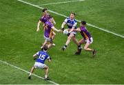 8 January 2023; Tommy Walsh of Kerins O'Rahilly's in action against Dan O'Brien, left, and Theo Clancy of Kilmacud Crokes during the AIB GAA Football All-Ireland Senior Club Championship Semi-Final match between Kilmacud Crokes of Dublin and Kerins O'Rahilly's of Kerry at Croke Park in Dublin. Photo by Daire Brennan/Sportsfile